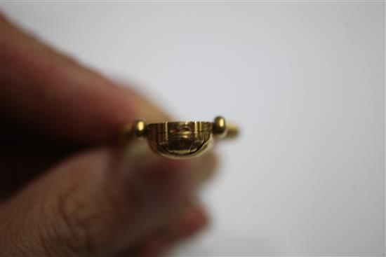 An early 20th century 14k gold swivelling Scarab locket ring, size N.